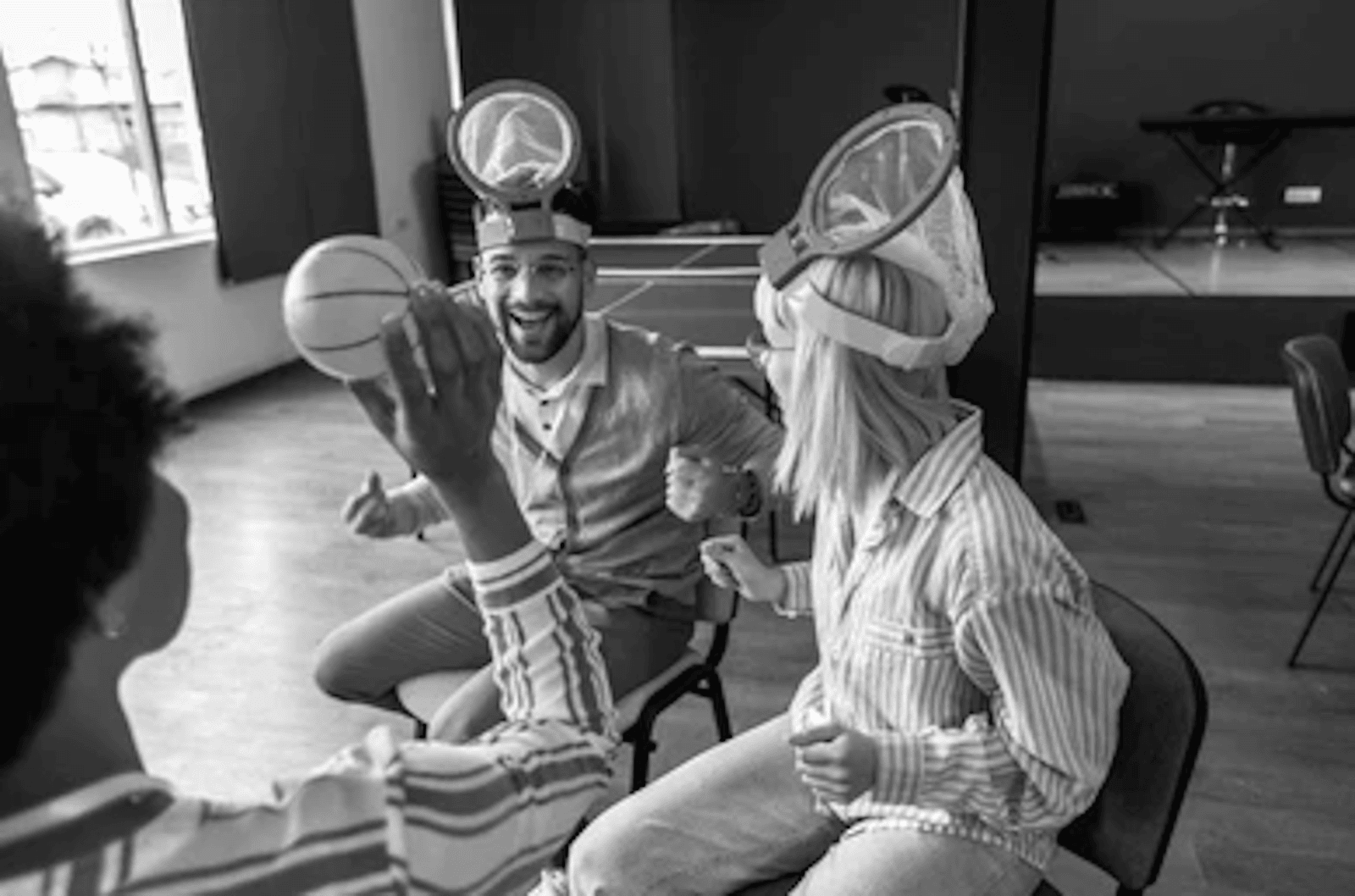 Black and white photo of generic corporate team building representing ineffective team activities.